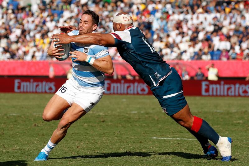 Argentina's full back Joaquin Tuculet (L) is tackled by US centre Paul Lasike during the Japan 2019 Rugby World Cup Pool C match between Argentina and the United States at the Kumagaya Rugby Stadium in Kumagaya. AFP