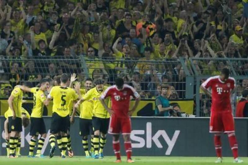 Dortmund gave their fans plenty to cheer about during a 4-2 victory over Bayern Munich in the German Super Cup on Saturday. Frank Augstein / AP Photo