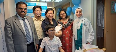 From left, Dr Prem Tanwar, Keith and Maricel Madoginog (holding Zedrick), Dr Pooja Agrawal, Dr Mais Ibrahim, and Zedrick's brother Zachary, in front. Photo: NMC Hospitals