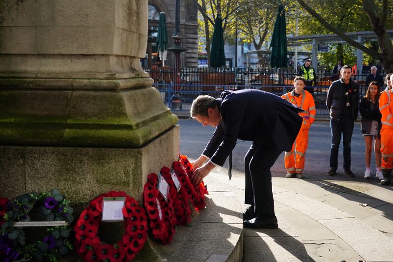 Labour leader Sir Keir Starmer lays a wreath at the war memorial at Euston Station in London. PA