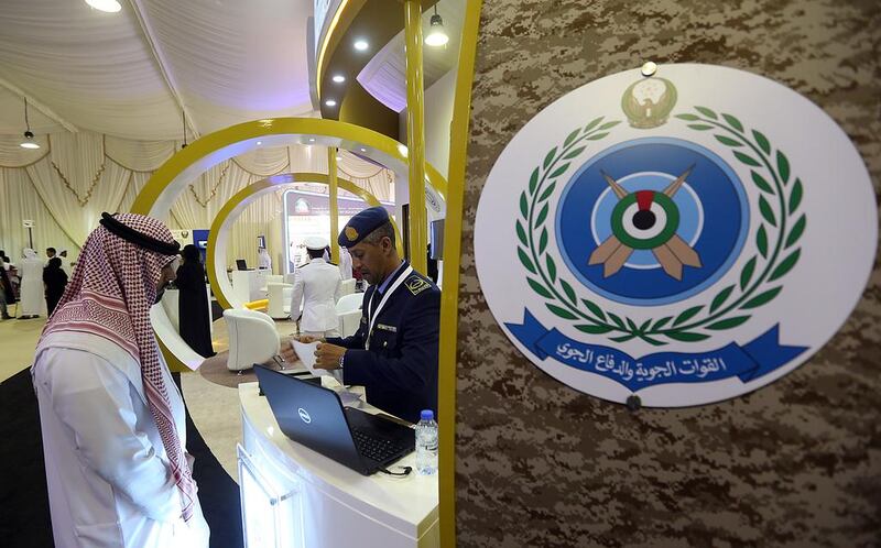 An Emirati man visits the GHQ Armed Forces stand during the Fujairah International Career and Education Fair. Satish Kumar / The National