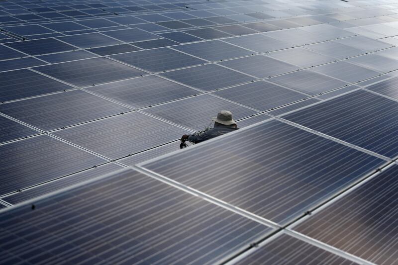 A worker works at a solar power plant by Superblock, Southeast Asia's biggest producer of solar power in Phetchaburi province, Thailand, August 23, 2017. REUTERS/Athit Perawongmetha     TPX IMAGES OF THE DAY
