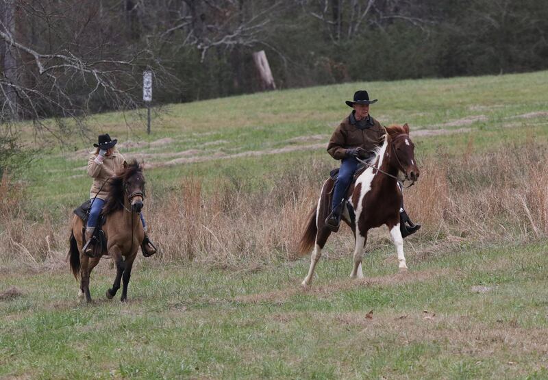 epa06385318 (left to right) Kayla Moore and her husband Roy Moore ride on horseback to vote in Gallant, Alabama, USA, 12 December 2017.  Citizens of Alabama will vote to decide whether Republican Roy Moore or Democrat Doug Jones will hold a Senate seat in the Federal government.  EPA/DAN ANDERSON