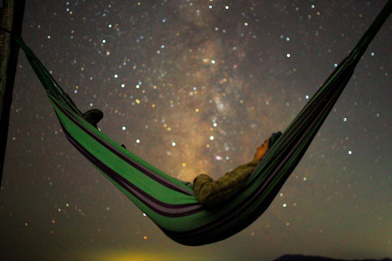 A girl lies in a hammock as she looks at the milky way during the peak of Perseid meteor shower in Kozjak, Macedonia. Reuters