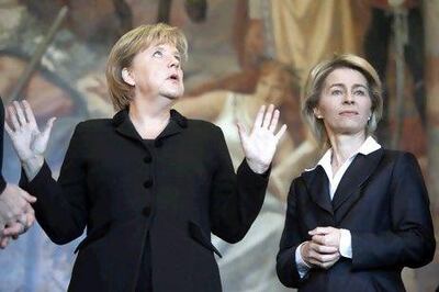 Ursula von der Leyen was a cabinet minister under former German chancellor Angela Merkel, left, before her move to Brussels in 2019. Reuters