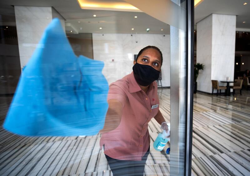 Abu Dhabi, United Arab Emirates, July 8, 2020.   
 A cleaner sanitises the lobby of Marriot Hotel Downtown, Abu Dhabi.
Victor Besa  / The National
For:  Hotels Opening AUH
Section:  NA 
Reporter: