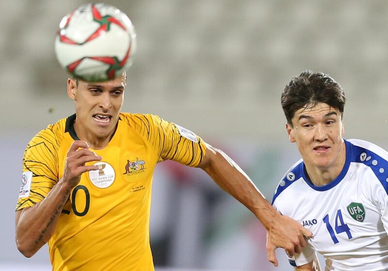 Trent Sainsbury of Australia, left, in action against Eldor Shomurodov of Uzbekistan during the 2019 Asian Cup last-16 match in Al Ain. EPA
