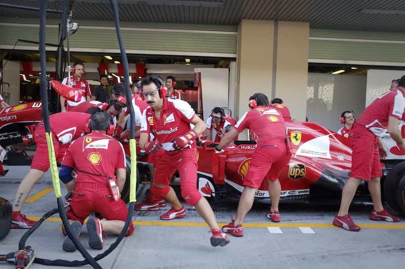 The Ferrari garage is a hive of activity.  Razan Alzayani / The National