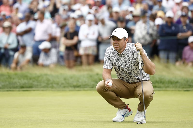 Rory McIlroy lines up a putt on the ninth green during the opening round of the US Open at The Country Club. Getty
