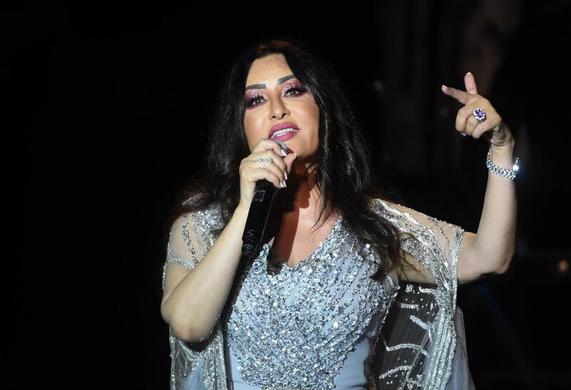 Tunisian singer Latifa performs at the Roman theater during the International Carthage Festival in the ancient city of the same name, just outside the Tunisian capital Tunis, late on July 18, 2019. (Photo by FETHI BELAID / AFP)