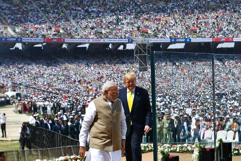 US President Donald Trump and India's Prime Minister Narendra Modi arrive to attend 'Namaste Trump' rally at Sardar Patel Stadium in Motera. AFP