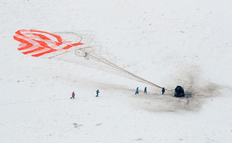 A search and rescue team approaches the Soyuz MS-09 capsule carrying the International Space Station crew after its landing in a remote area outside the town of Dzhezkazgan, Kazakhstan. AFP