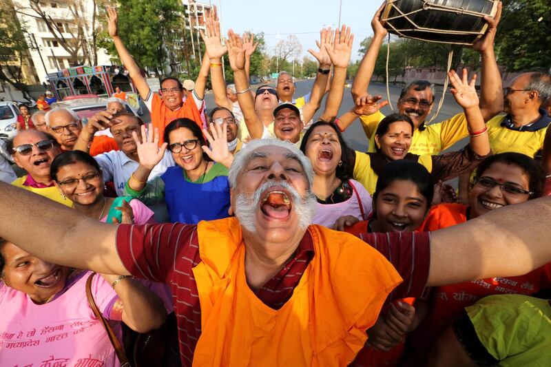 Members of various laughter clubs perform laughing exercises as they take part in a rally on the occasion of the World Laughter Day in Bhopal, India. Sanjeev Gupta / EPA