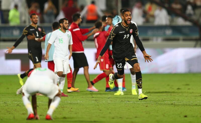 Bahrain players celebrate after the match. Reuters