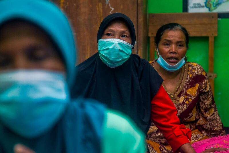 Villagers gather inside a makeshift shelter at a class room after they fled their villages due to the eruption of Mount Semeru in Lumajang, East Java, Indonesia. EPA