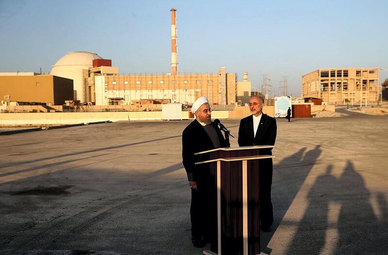 A handout picture released by the official website of the Iranian President Hassan Rouhani, shows him (L) and Iran's Atomic Energy Organisation chief Ali Akbar Salehi addressing journalists at the Bushehr nuclear power plant in the Gulf port city of Bushehr on January 13, 2015. Rouhani implicitly warned US lawmakers against adopting any new sanctions linked to Iran's controversial nuclear programme, saying they would fail as his country was beginning to exit the sanctions-era. AFP PHOTO / IRANIAN PRESIDENCY WEBSITE / MOHAMMAD BERNO 
== RESTRICTED TO EDITORIAL USE - MANDATORY CREDIT "AFP PHOTO / IRANIAN PRESIDENCY WEBSITE / MOHAMMAD BERNO " - NO MARKETING NO ADVERTISING CAMPAIGNS - DISTRIBUTED AS A SERVICE TO CLIENTS == (Photo by MOHAMMAD BERNO / IRANIAN PRESIDENCY / AFP)