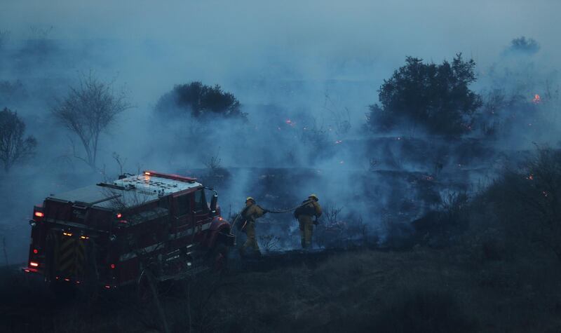 Fires that have raged around Los Angeles this week spread to the San Diego area on Thursday amid unusually dry, hot, windy conditions across the region. Mike Blake / Reuters