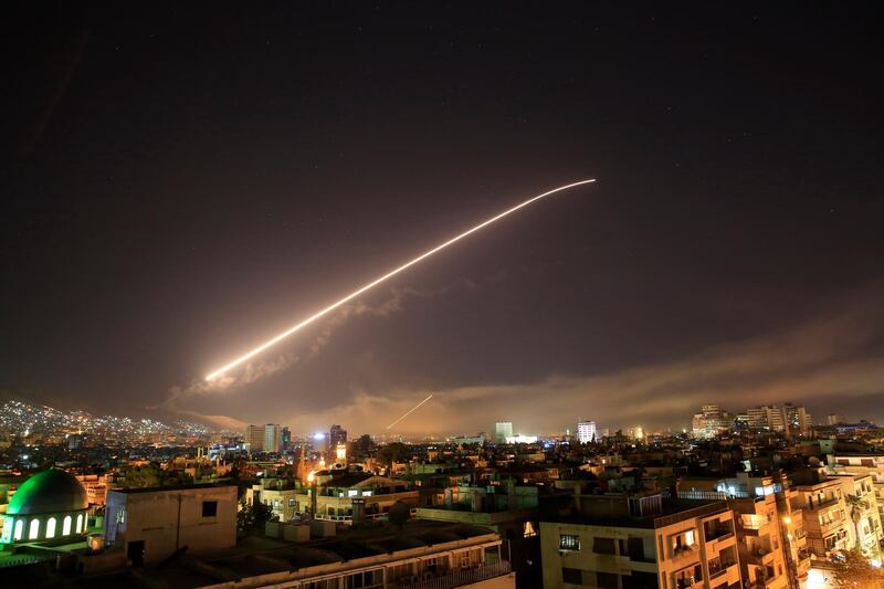 The Damascus sky lights up with missile fire as the US launches an attack on Syria targeting different parts of the capital. Hassan Ammar / AP Photo
