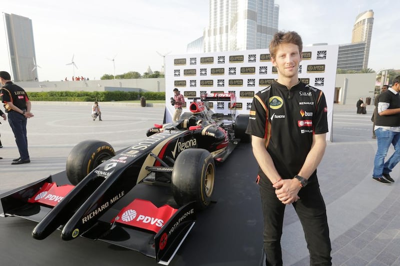 Romain Grosjean and the Lotus team took time out to address the press and sponsors at the base of Burj Khalifa, Dubai. Jaime Puebla / The National