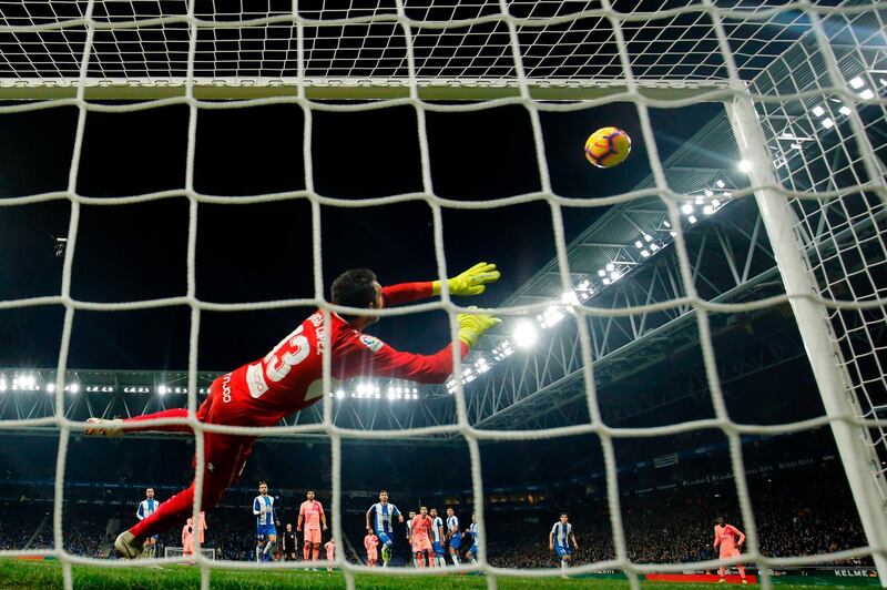 Lionel Messi's free-kick heads goalward and past Espanyol goalkeeper Diego Lopez. AFP