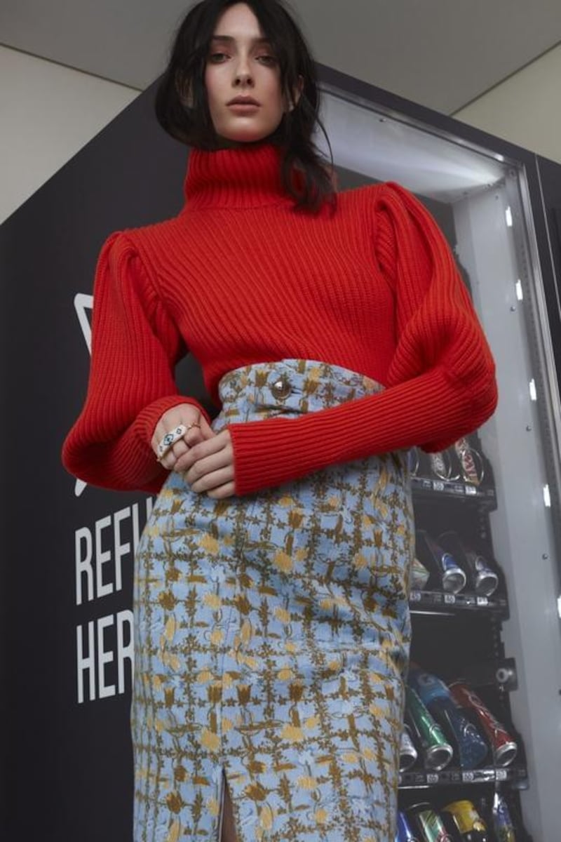 CLOSE KNIT: Sweater, Dh3,900; skirt, Dh5,000, both from Christian Dior. Bracelet (around hand), Dh530, Shourouk at S*uce