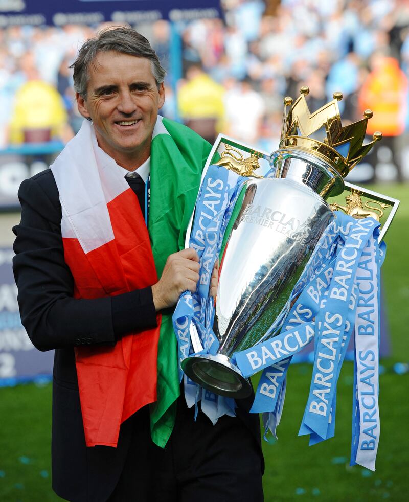 Manchester City's manager Roberto Mancini with the 2012 Premier League cup. AFP