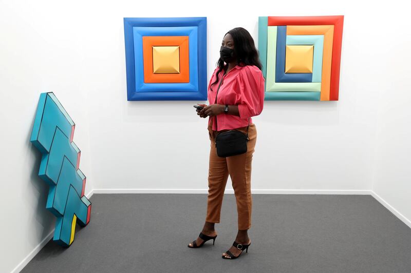 Dubai, United Arab Emirates - Reporter: Alexandra Chaves. Arts and Lifestyle. A visitor looks at a pieces by Shaikha Al Mazrou. Art Dubai 2021 opens at the DIFC. Tuesday, March 30th, 2021. Dubai. Chris Whiteoak / The National