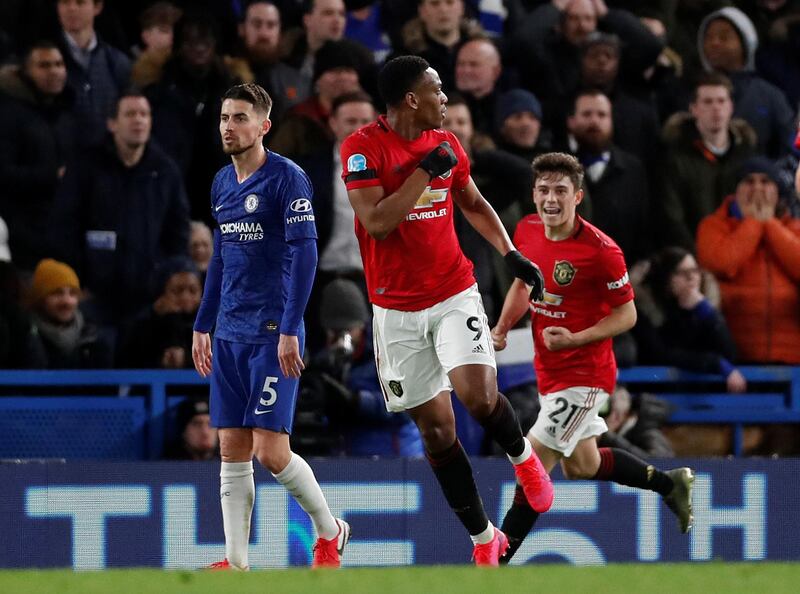 Anthony Martial celebrates scoring their first goal with Daniel James as Chelsea's Jorginho looks dejected. Reuters