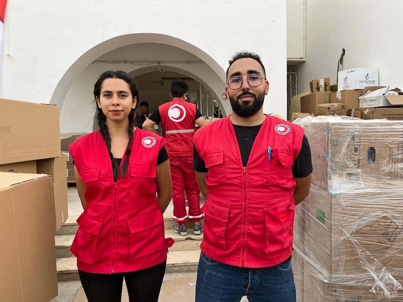Tunisian Red Crescent volunteers at their central headquarters collecting and organising donations made by Tunisians for people in Gaza. Ghaya Ben Mbarek / The National