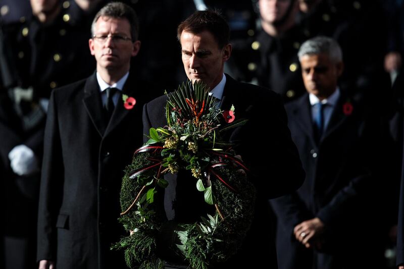 LONDON, ENGLAND - NOVEMBER 11: British Foreign Secretary Jeremy Hunt lays a wreath during the annual Remembrance Sunday memorial at the Cenotaph on Whitehall on November 11, 2018 in London, England. The armistice ending the First World War between the Allies and Germany was signed at Compiègne, France on eleventh hour of the eleventh day of the eleventh month - 11am on the 11th November 1918. This day is commemorated as Remembrance Day with special attention being paid for this years centenary. (Photo by Jack Taylor/Getty Images)