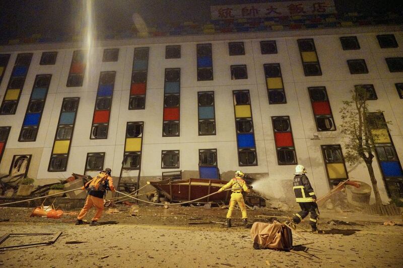 Rescure workers search the damaged Marshal Hotel in Hualien. Paul Yang / AFP