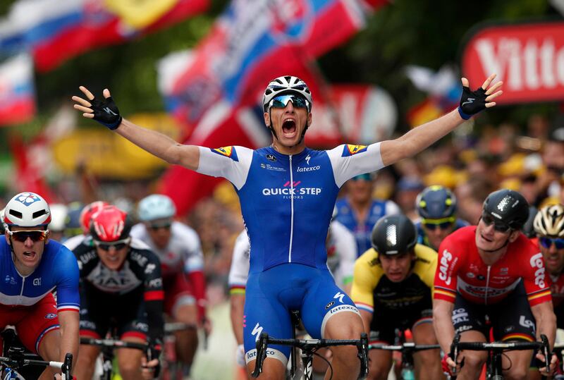 Germany's Marcel Kittel celebrates as he crosses the finish line to win the second stage of the Tour de France on Sunday. Christophe Ena / AP Photo