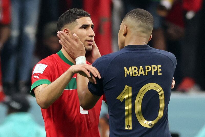 France's Kylian Mbappe comforts Morocco's Achraf Hakimi at the end of the Qatar 2022 World Cup semi-final. AFP