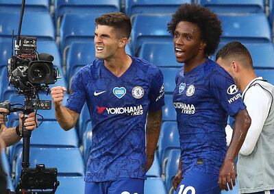 Chelsea's US midfielder Christian Pulisic (L) celebrates scoring the opening goal with Chelsea's Brazilian midfielder Willian during the English Premier League football match between Chelsea and Manchester City at Stamford Bridge in London on June 25, 2020.  - RESTRICTED TO EDITORIAL USE. No use with unauthorized audio, video, data, fixture lists, club/league logos or 'live' services. Online in-match use limited to 120 images. An additional 40 images may be used in extra time. No video emulation. Social media in-match use limited to 120 images. An additional 40 images may be used in extra time. No use in betting publications, games or single club/league/player publications.
 / AFP / POOL / Julian Finney / RESTRICTED TO EDITORIAL USE. No use with unauthorized audio, video, data, fixture lists, club/league logos or 'live' services. Online in-match use limited to 120 images. An additional 40 images may be used in extra time. No video emulation. Social media in-match use limited to 120 images. An additional 40 images may be used in extra time. No use in betting publications, games or single club/league/player publications.
