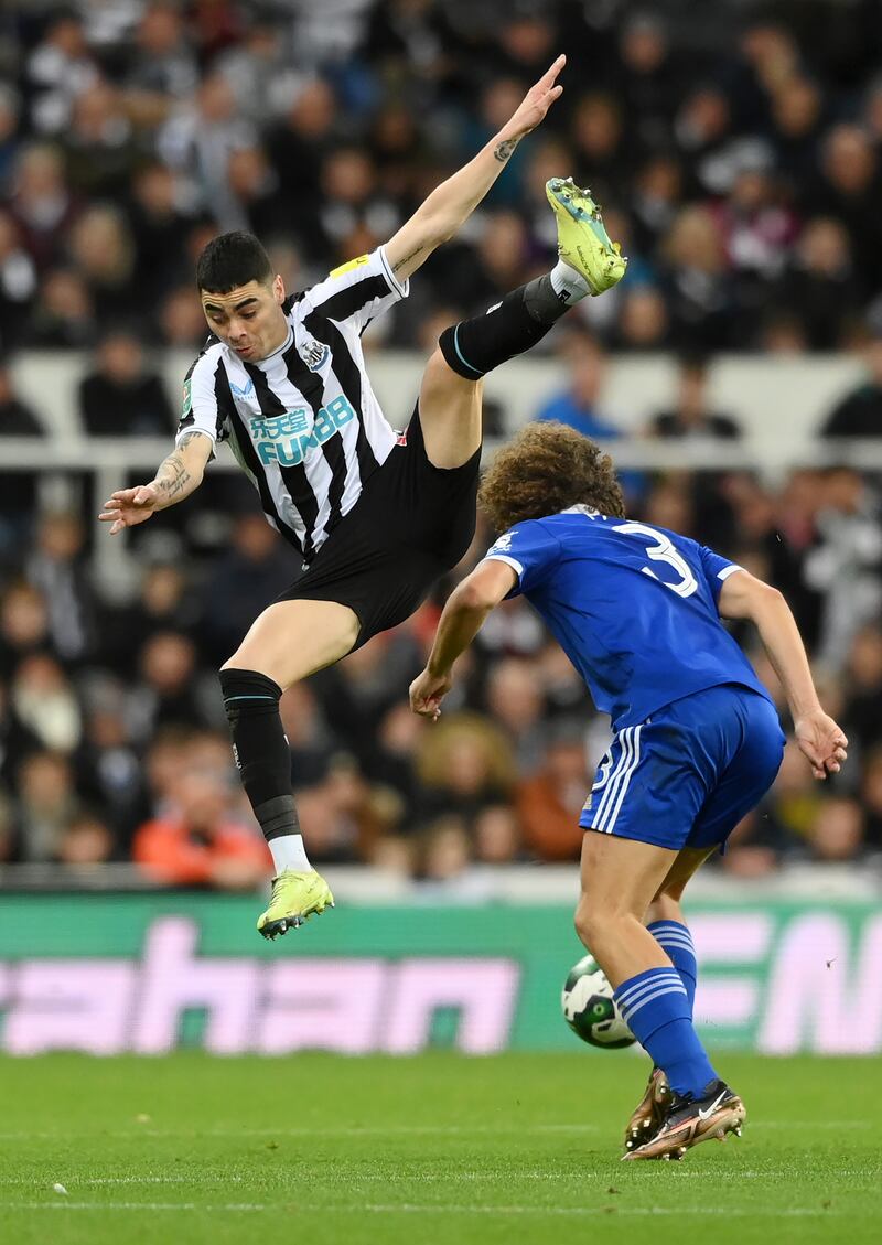 Newcastle's Miguel Almiron jumps past Wout Faes of Leicester. Getty