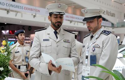 ABU DHABI,  UNITED ARAB EMIRATES , OCTOBER 6 – 2019 :- Major Ahmed Surour Al Shamsi ( center ) at the Abu Dhabi Police stand during the 26th World Road Congress exhibition held at Abu Dhabi National Exhibition Center in Abu Dhabi. ( Pawan Singh / The National ) For News. Story by Patrick