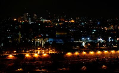 TOPSHOT - A picture taken on December 6, 2017 shows a view of the old city of Jerusalem from the Mount of the Olives, after the Palestinian Ministry for Endowments and Religious affairs shut off the lights of the Dome of the Rock in the Aqsa mosque compound.
US President Donald Trump is expected to make an announcement to recognise Jerusalem as Israel's capital on December 6.
The old city lies in the eastern part of Jerusalem which was under Jordanian control from Israel's creation in 1948 until Israeli forces captured it during the 1967 Six-Day War. 
Israel later annexed East Jerusalem in a move not recognised by the international community. / AFP PHOTO / Ahmad GHARABLI