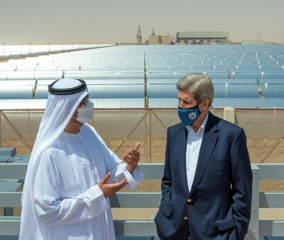 US climate envoy John Kerry speaks with Dr Sultan Al Jaber, UAE Special Envoy for Climate Change, at Abu Dhabi's Noor solar park. The National 