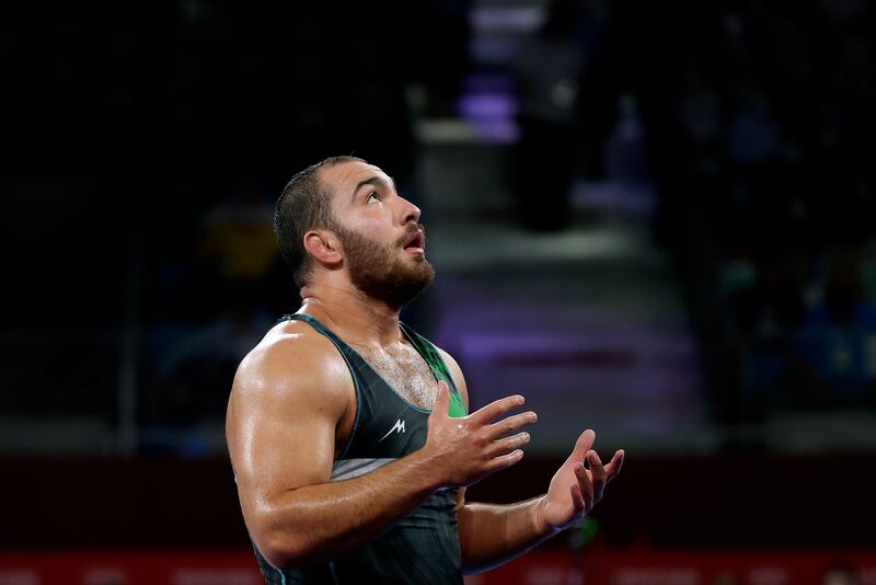 Iranian wrestler Hossein Amir Zare looks exhausted after defeating Zhiwei Deng of China in an epic bout to win the men’s freestyle 125kg bronze.