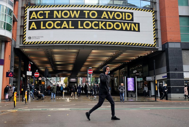 A sign in Manchester appeals to the public to adhere to the Covid-19 restrictions. Reuters