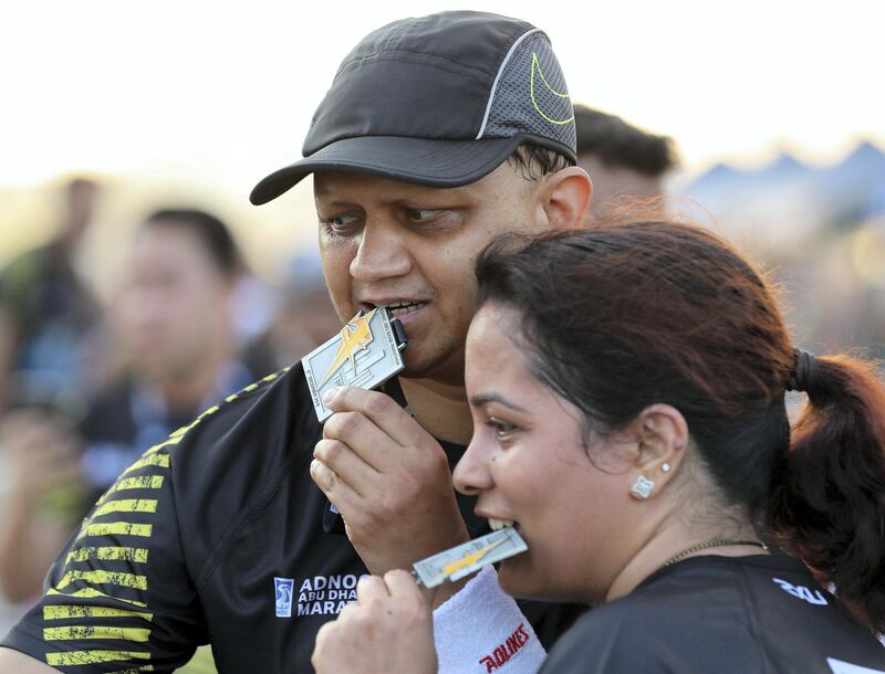 Abu Dhabi, United Arab Emirates - December 06, 2019: Athletes finish the 10K in the ADNOC Abu Dhabi marathon 2019. Friday, December 6th, 2019. Abu Dhabi. Chris Whiteoak / The National