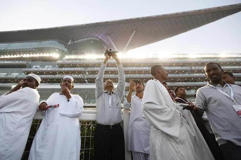 Spectators watch the 18th Dubai World Cup at Meydan Racecourse in 2013. Sarah Dea / The National