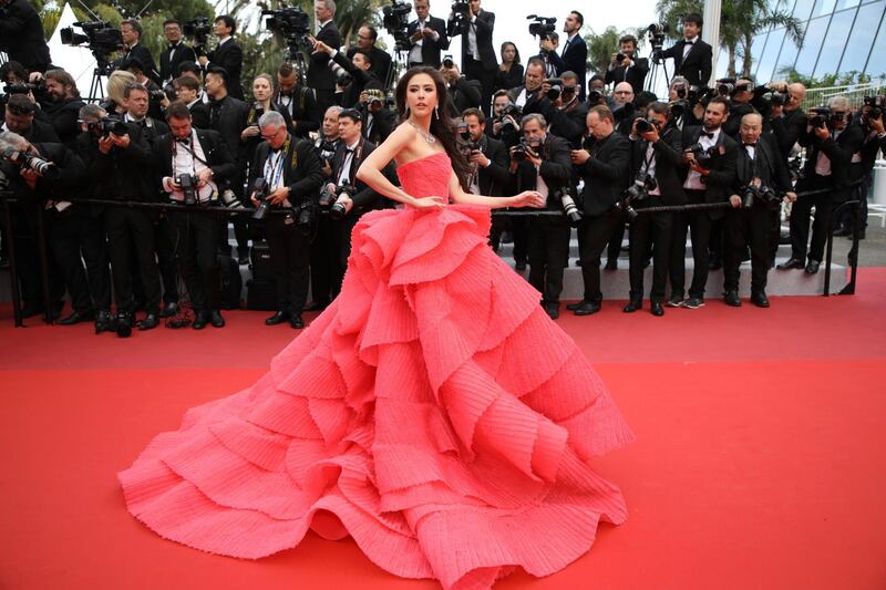 Jensen's coral tulle layered gown was specially made for her by Cinco. Getty Images