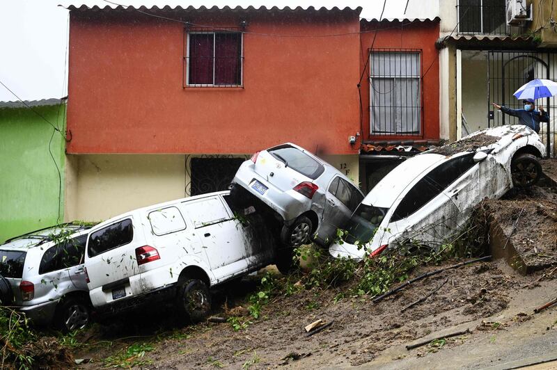 Cars damaged and swept during floods caused by Tropical Storm Cristobal, are seen in Panchimalco, El Salvador. Tropical Storm Cristobal's formation in the Gulf of Mexico marked a new record as the earliest that the Atlantic hurricane season has seen its third named disturbance, US meteorologists said Tuesday.   AFP