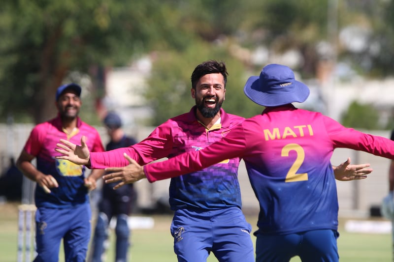 Rohan Mustafa celebrates taking a wicket - he took three for 34. 