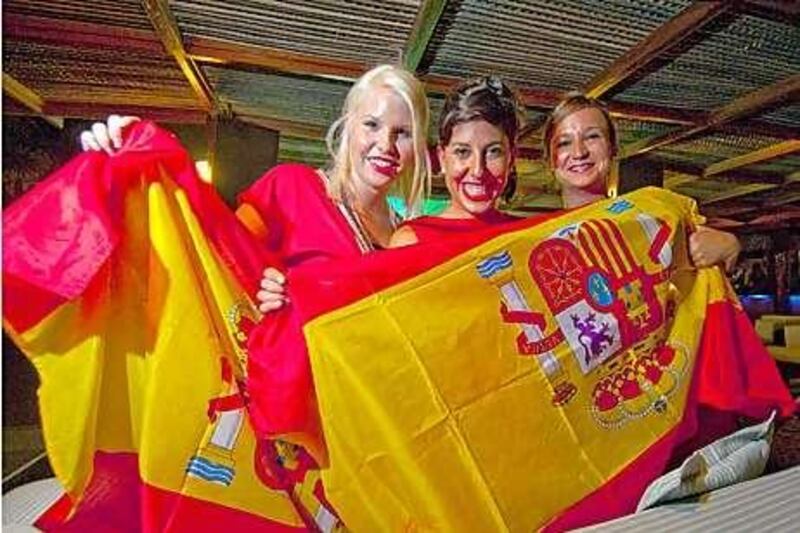 Spanish supporters, from left, Dana Bettell, Cristina Martinmunoz and Amaia Delgado watched the semi-final game against Germany at the Barasti Bar in Dubai.