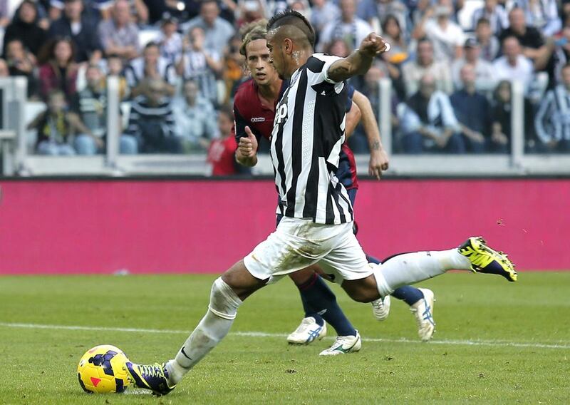 Juventus' Chilean midfielder Arturo Vidal takes a penalty kick to score his team's second goal during the Italian Serie A football match between Juventus and Genoa at Juventus Stadium in Turin on October 27, 2013.  AFP PHOTO / MARCO BERTORELLO