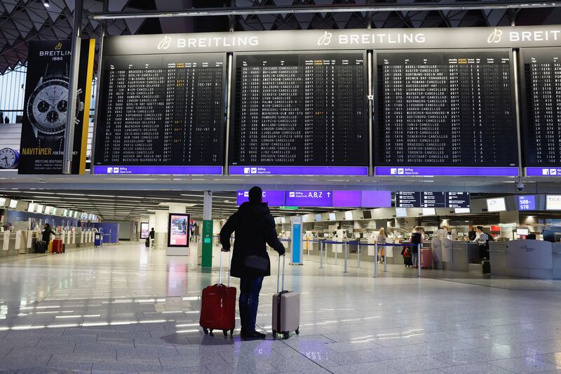 A passenger checks the departure boards at Frankfurt Airport. Reuters