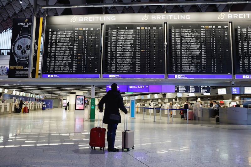 A passenger checks the departure boards at Frankfurt Airport. Reuters