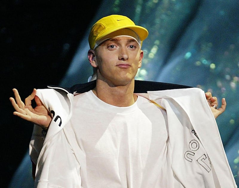 (FILES) This file photo taken on August 29, 2002 shows Eminem walking on stage to accept the Video of the Year Award at the MTV Video Music Awards in New York.  Guess who's back?... Rapper Eminem surprised fans on January 17, 2020, by dropping a new album featuring a strong anti-gun violence theme but also stoking the kind of controversy that brought him fame. On the album, one track called "Darkness" tells the story of a loner going on a shooting spree, while another song, "Unaccommodating," has triggered outcry and muddied the veteran singer's call for gun control. The song references the 2017 deadly bombing at an Ariana Grande concert in Manchester, Britain, which left 22 people dead. - 
 / AFP / TIMOTHY A. CLARY
